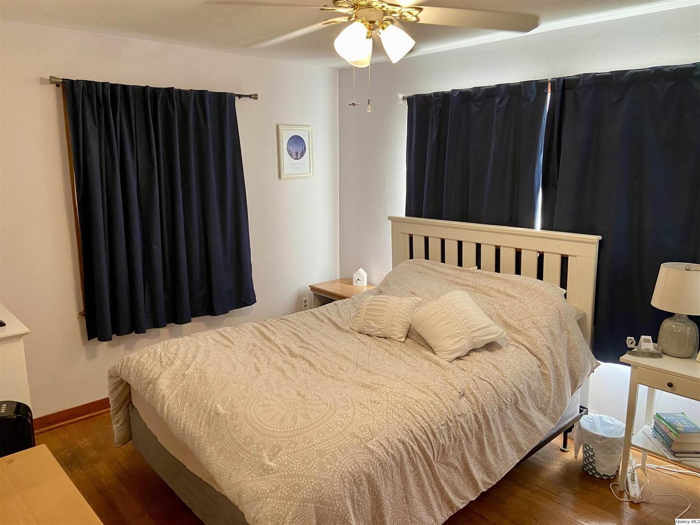 1632 North 24th Street Quincy, IL 62301 - Photo 12 of 36 a bedroom with a bed and a mirror