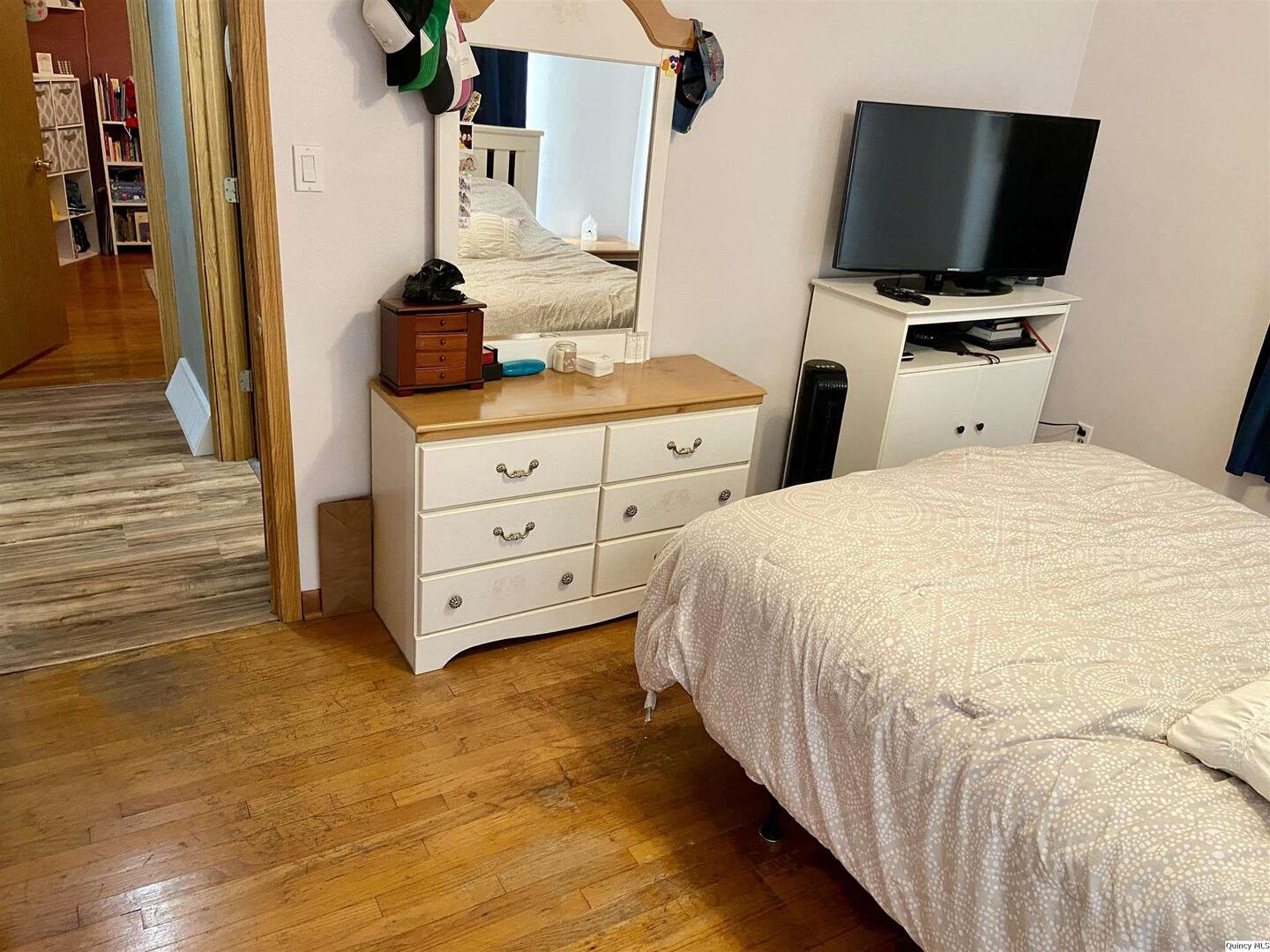 1632 North 24th Street Quincy, IL 62301 - Photo 13 of 36 a bedroom with a bed and flat screen tv