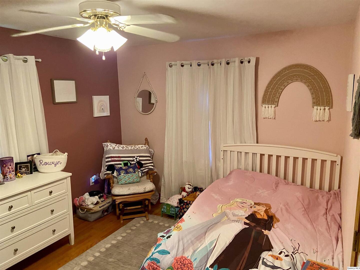 1632 North 24th Street Quincy, IL 62301 - Photo 18 of 36 a bedroom with a bed and a chandelier