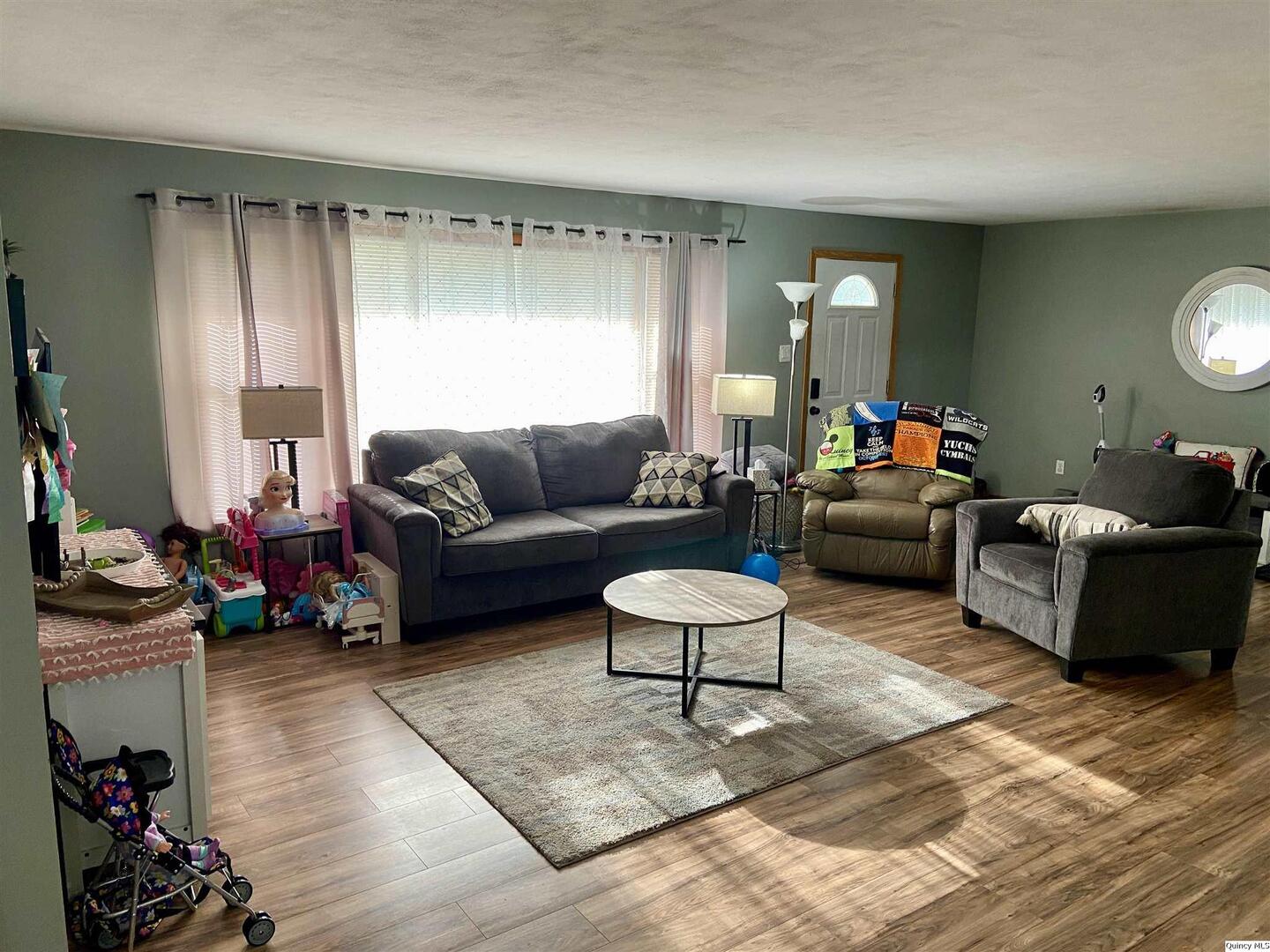 1632 North 24th Street Quincy, IL 62301 - Photo 2 of 36 a living room with furniture and a wooden floor