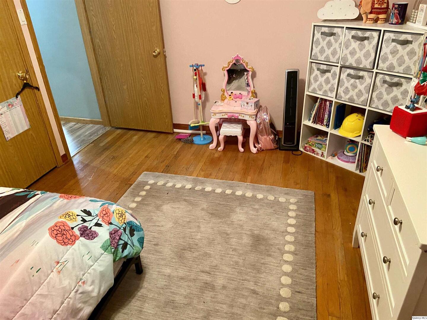 1632 North 24th Street Quincy, IL 62301 - Photo 21 of 36 a bedroom with bed and a mirror