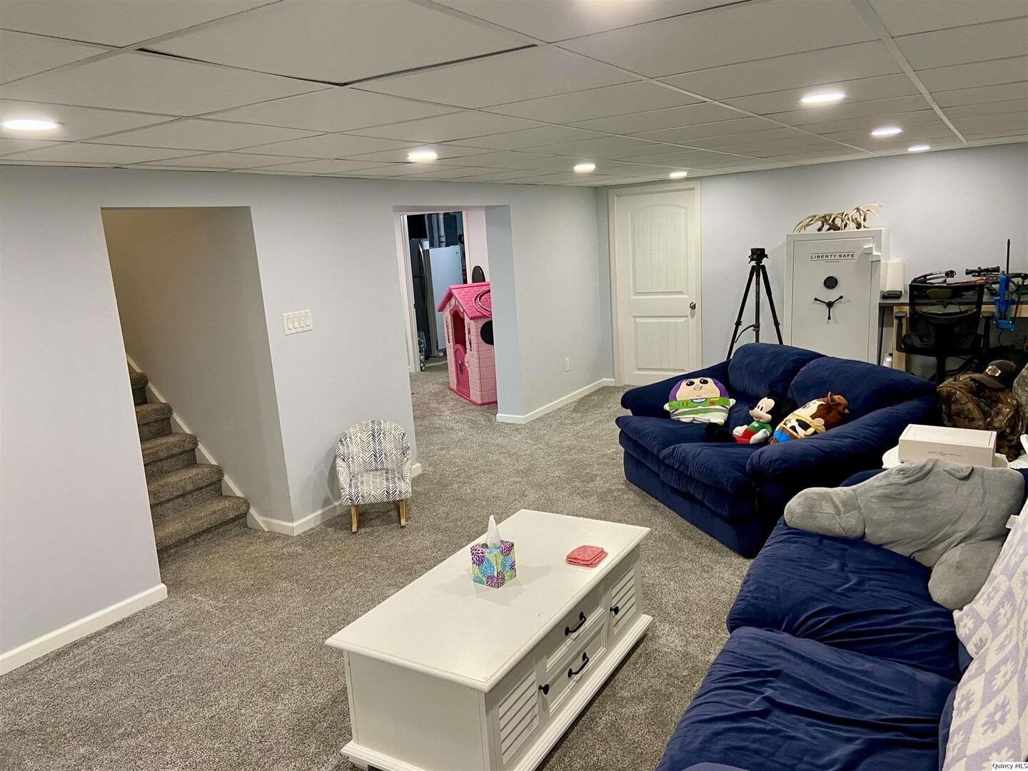 1632 North 24th Street Quincy, IL 62301 - Photo 25 of 36 a living room with furniture and a gym equipment