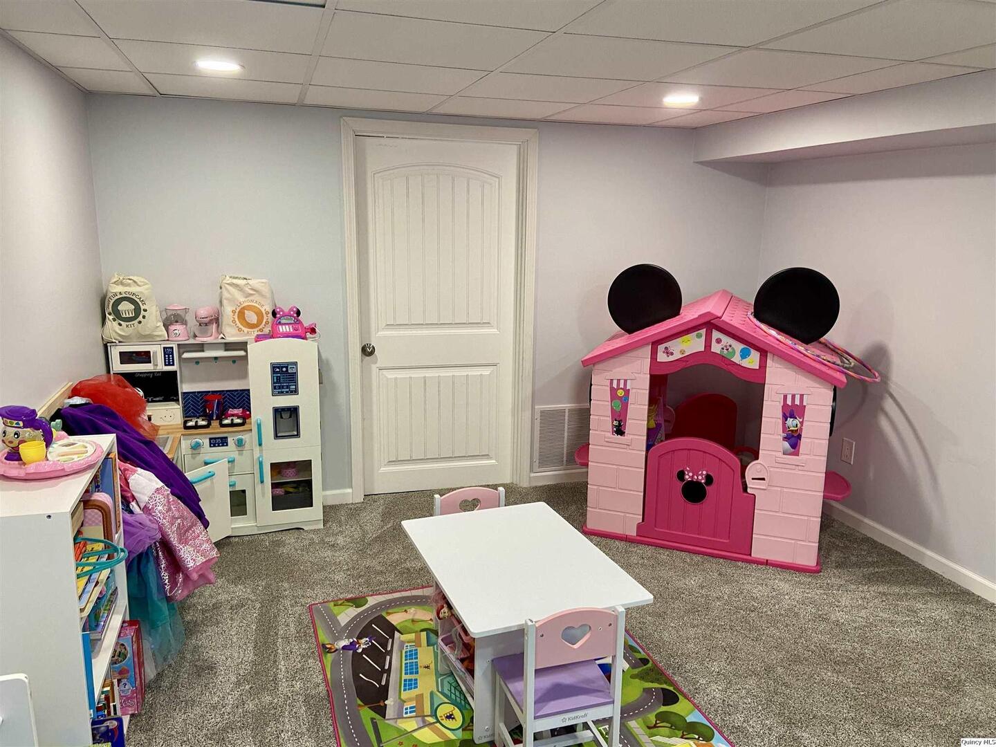 1632 North 24th Street Quincy, IL 62301 - Photo 26 of 36 a bedroom with a bed and a chandelier