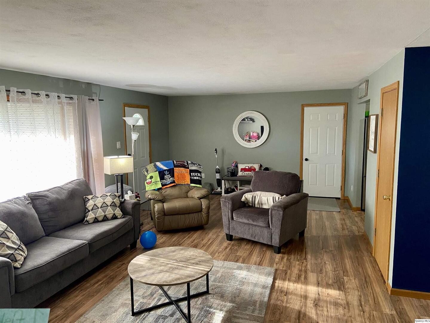 1632 North 24th Street Quincy, IL 62301 - Photo 8 of 36 a living room with furniture and a window