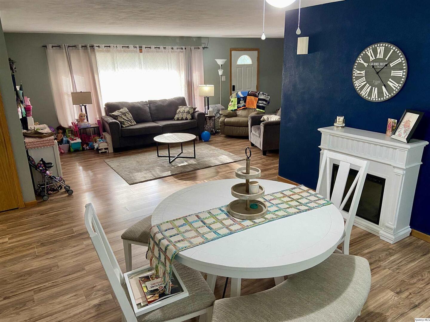 1632 North 24th Street Quincy, IL 62301 - Photo 9 of 36 a living room with furniture a rug and a window
