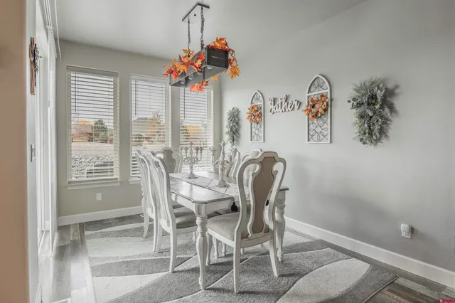 a dining room with furniture and window