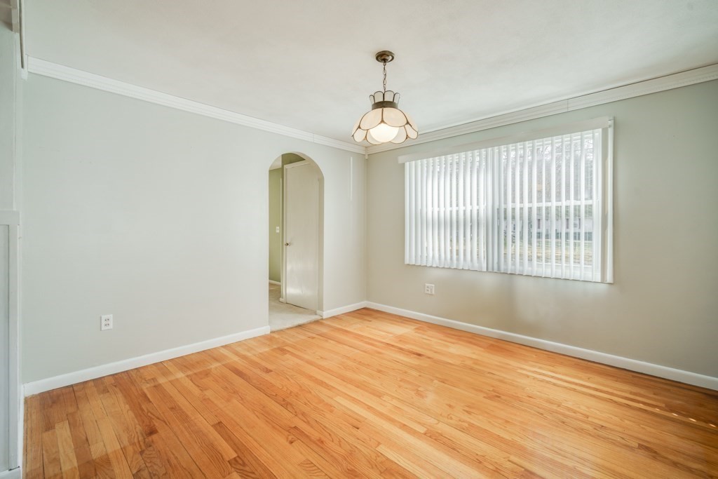 48 Fair Oak Road Springfield, MA 01128 - Photo 11 of 42 a view of an empty room with wooden floor and a window