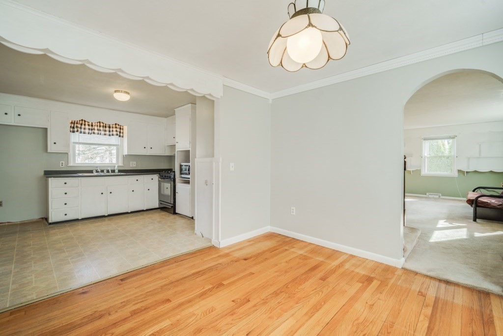 48 Fair Oak Road Springfield, MA 01128 - Photo 12 of 42 a kitchen with a sink cabinets and wooden floor