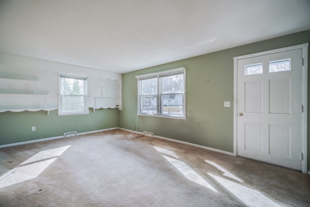 48 Fair Oak Road Springfield, MA 01128 - Photo 18 of 42 a view of an empty room with window and wooden floor