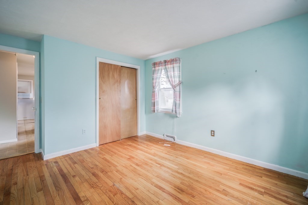 48 Fair Oak Road Springfield, MA 01128 - Photo 19 of 42 an empty room with wooden floor and windows