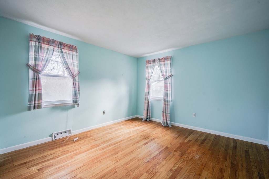 48 Fair Oak Road Springfield, MA 01128 - Photo 20 of 42 a view of empty room with wooden floor and fan