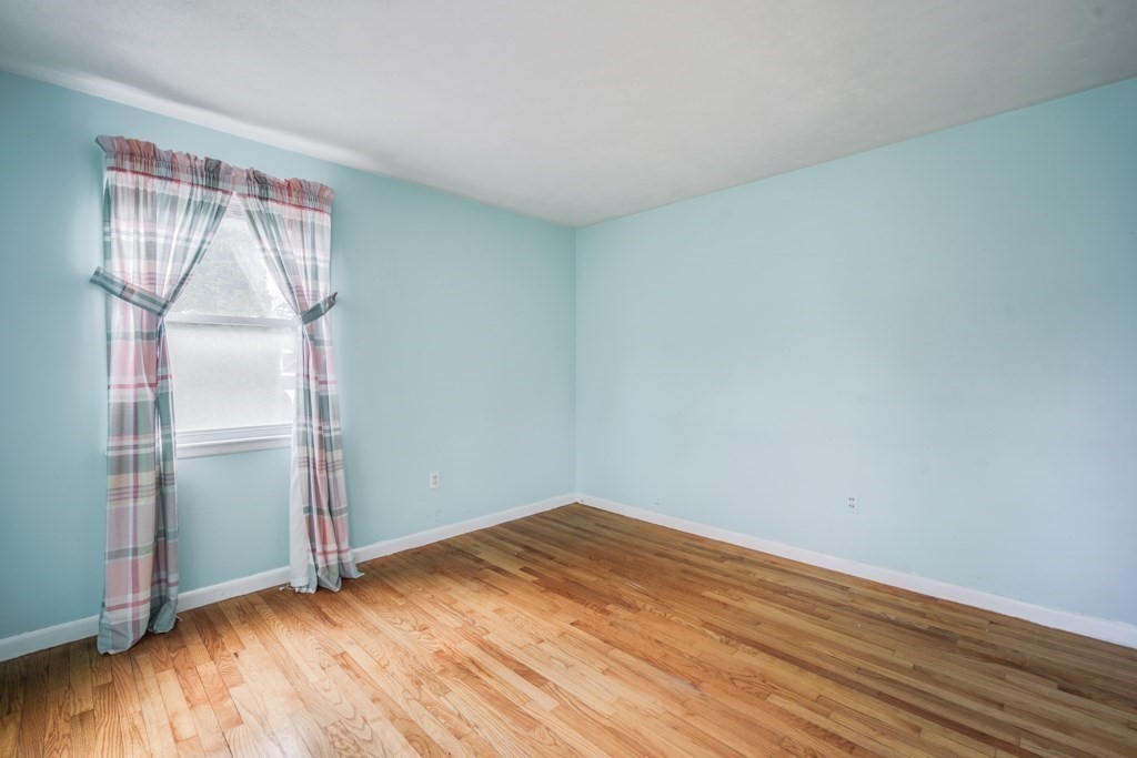 48 Fair Oak Road Springfield, MA 01128 - Photo 21 of 42 an empty room with wooden floor and windows