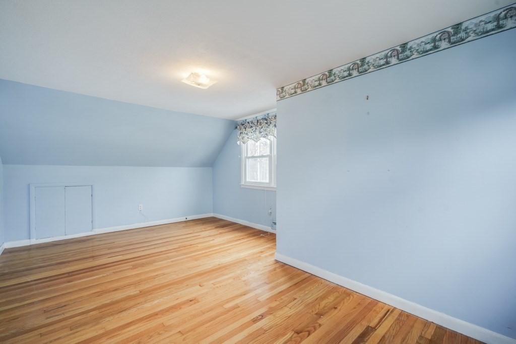 48 Fair Oak Road Springfield, MA 01128 - Photo 25 of 42 a view of an empty room with window and wooden floor