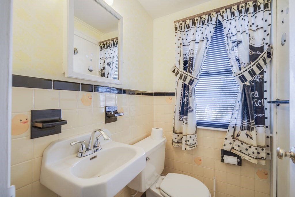 48 Fair Oak Road Springfield, MA 01128 - Photo 27 of 42 a bathroom with a sink mirror and toilet