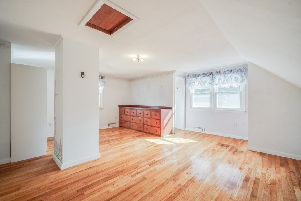 48 Fair Oak Road Springfield, MA 01128 - Photo 32 of 42 a view of an empty room with wooden floor and a window