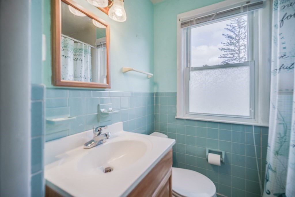 48 Fair Oak Road Springfield, MA 01128 - Photo 33 of 42 a bathroom with a sink mirror and toilet