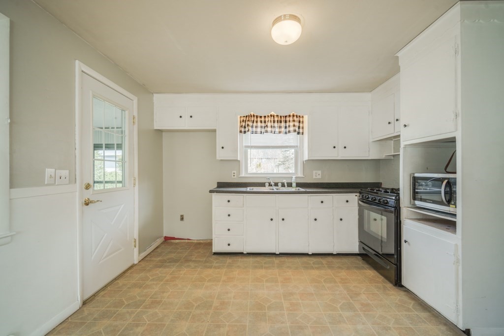 48 Fair Oak Road Springfield, MA 01128 - Photo 10 of 42 a kitchen with stainless steel appliances granite countertop a refrigerator and a stove