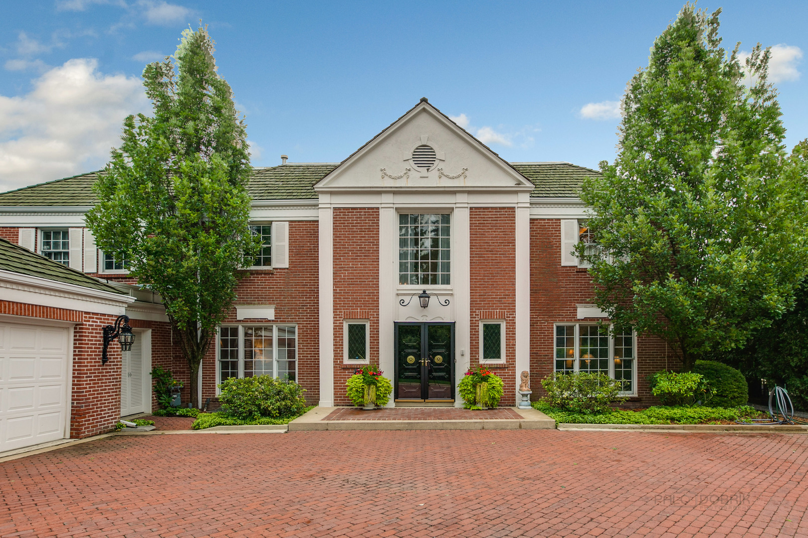 473 Sheridan Road Winnetka, IL 60093 - Photo 2 of 32 front view of a house with a yard