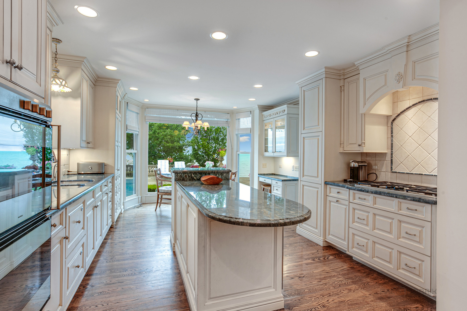 473 Sheridan Road Winnetka, IL 60093 - Photo 11 of 32 a kitchen with sink stove and cabinets