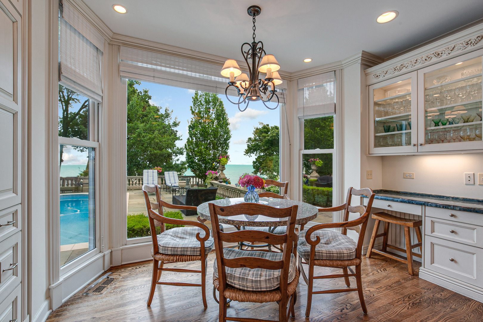 473 Sheridan Road Winnetka, IL 60093 - Photo 13 of 32 a dining room with furniture a chandelier and wooden floor