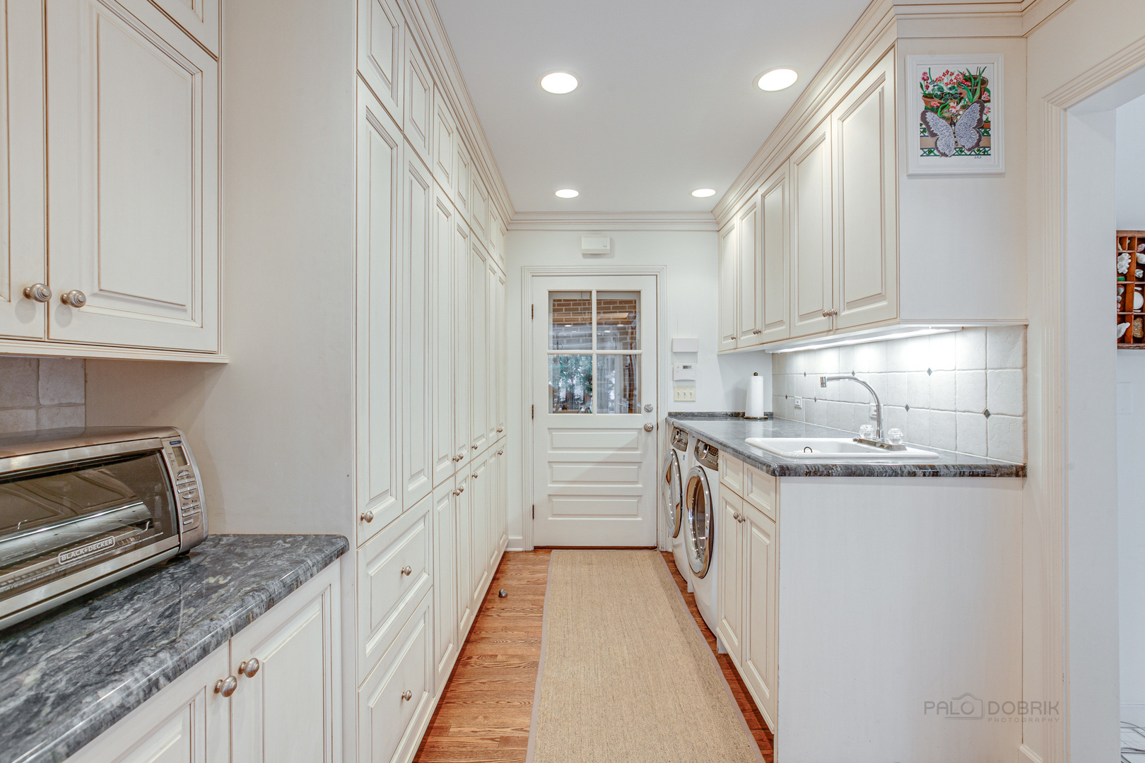 473 Sheridan Road Winnetka, IL 60093 - Photo 14 of 32 a kitchen with granite countertop a sink and cabinets
