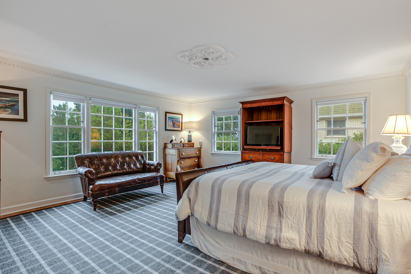 473 Sheridan Road Winnetka, IL 60093 - Photo 16 of 32 a bedroom with a bed couch and a large window