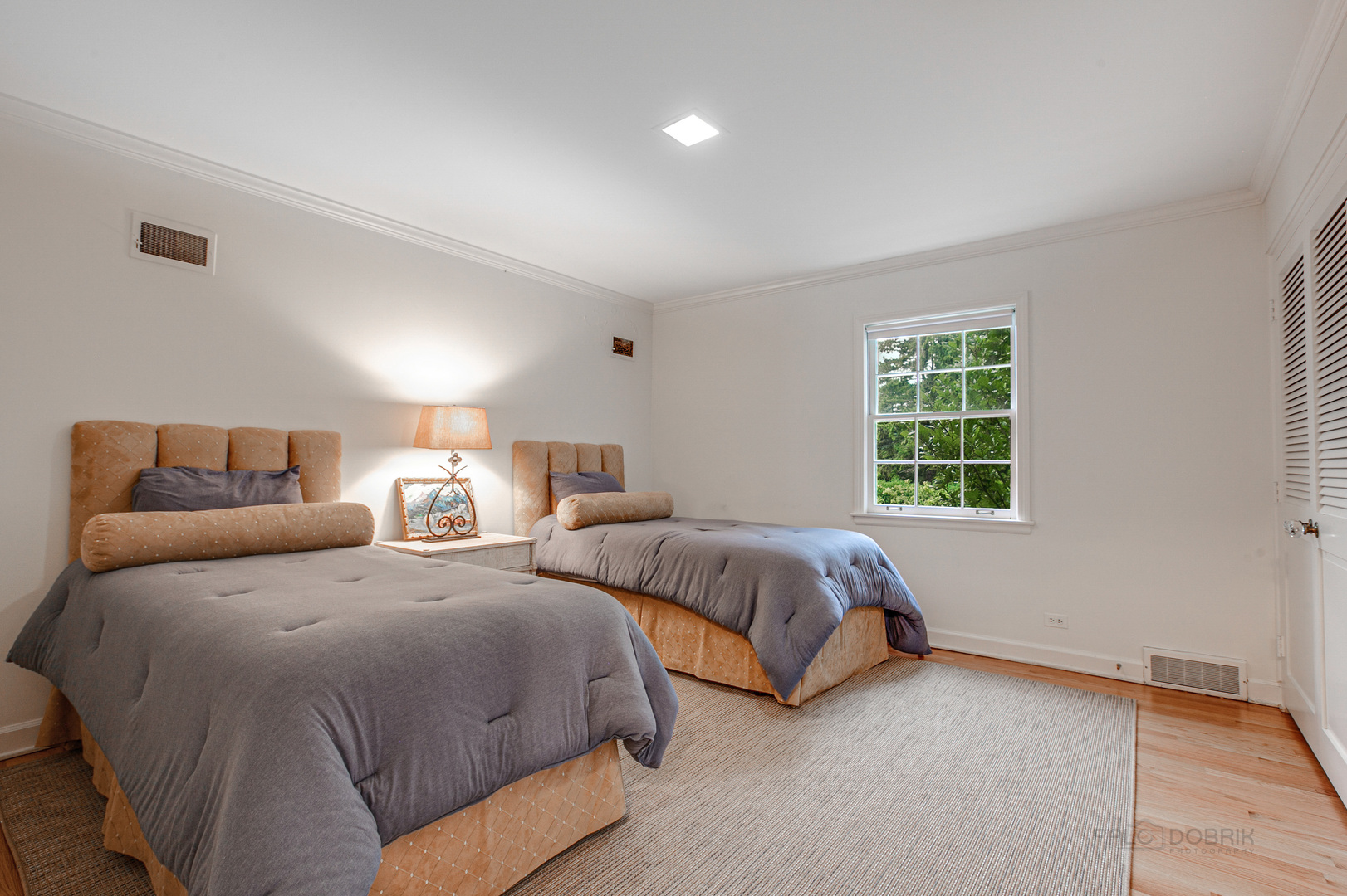 473 Sheridan Road Winnetka, IL 60093 - Photo 20 of 32 a bedroom with two beds and a window