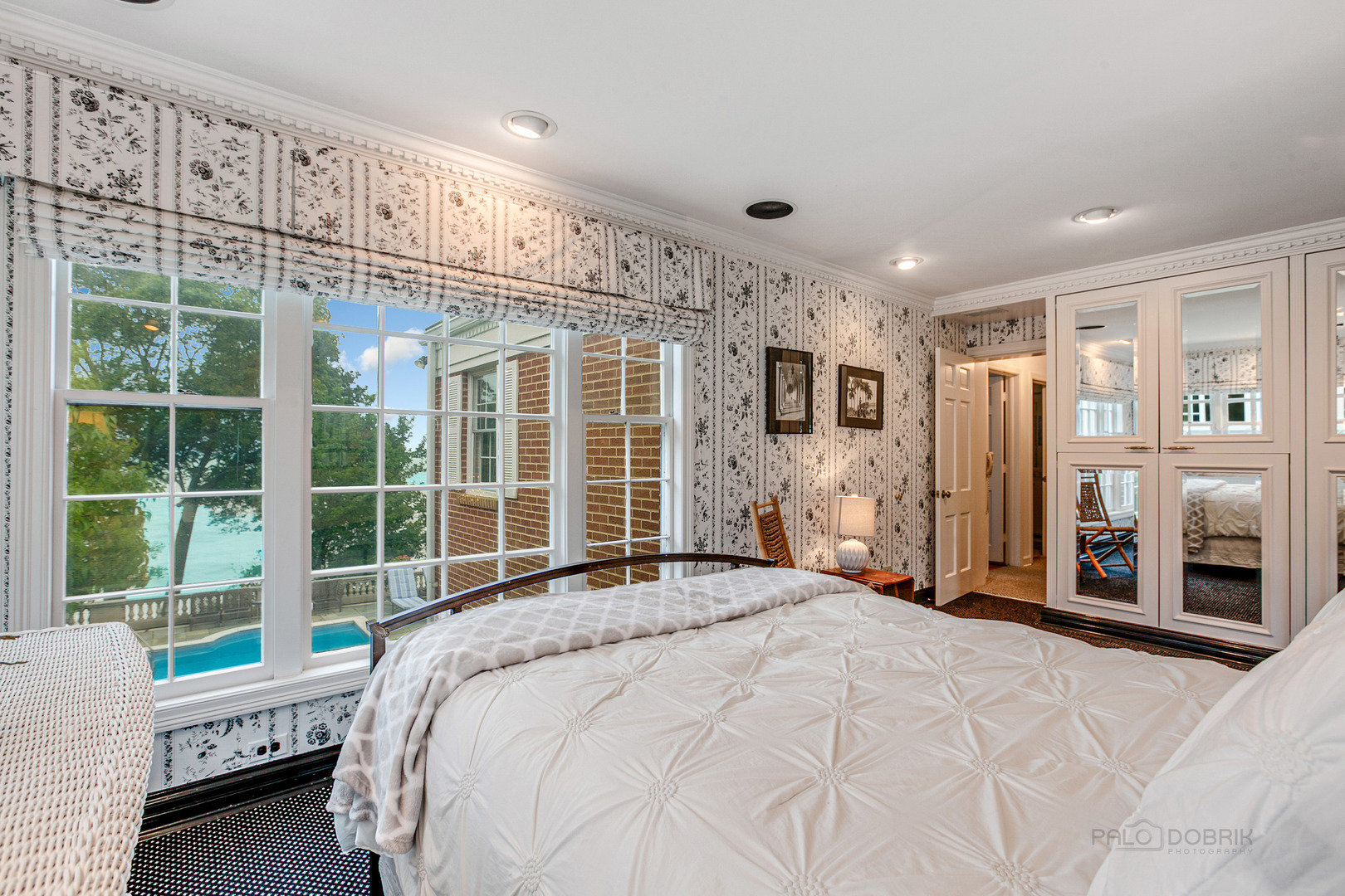 473 Sheridan Road Winnetka, IL 60093 - Photo 21 of 32 a spacious bedroom with a large bed and a large window
