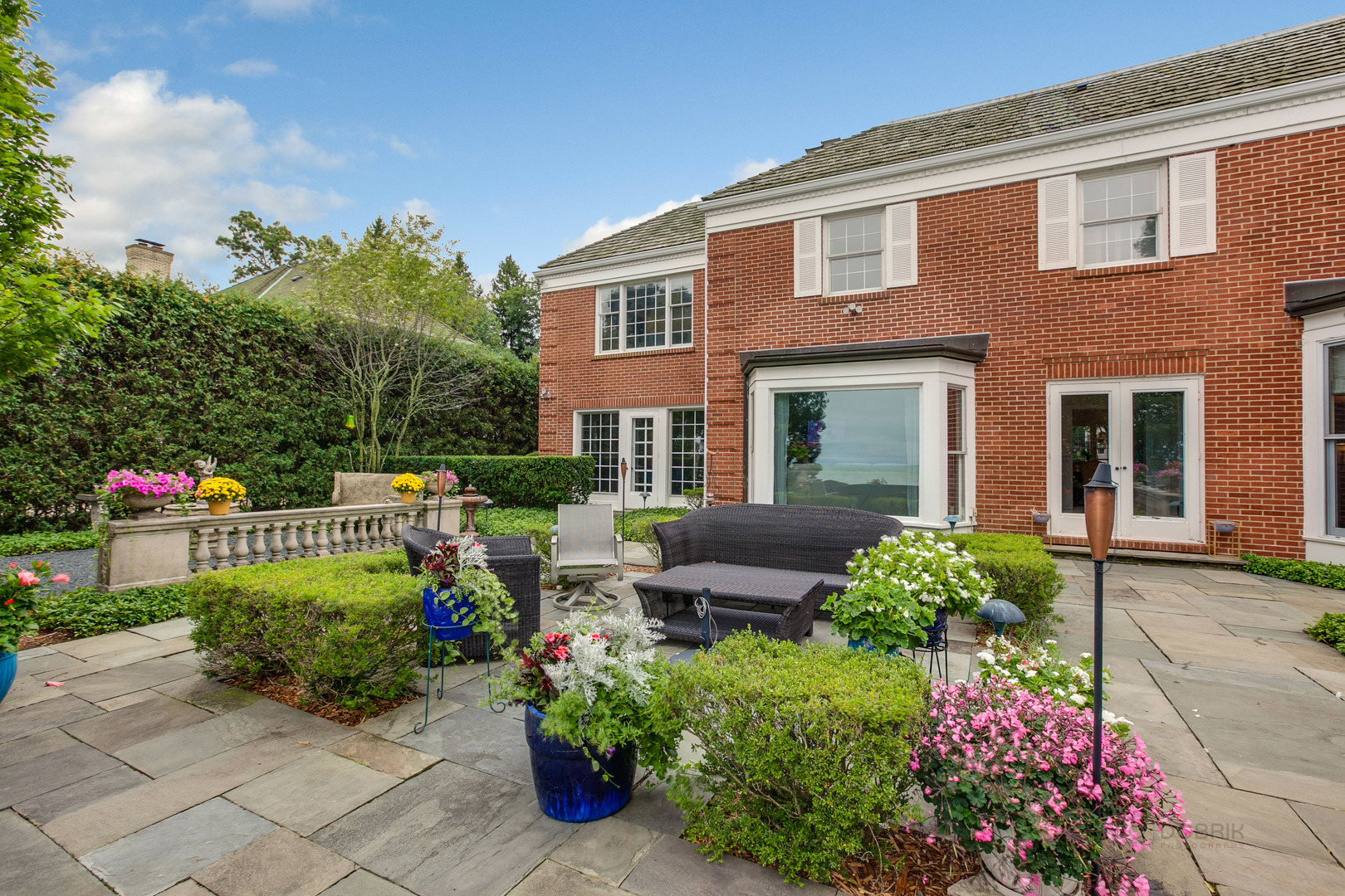 473 Sheridan Road Winnetka, IL 60093 - Photo 24 of 32 front view of a house with a garden