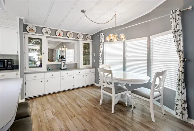a view of a dining room with furniture and window