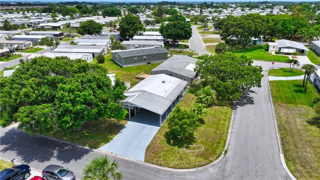 an aerial view of a house with outdoor space