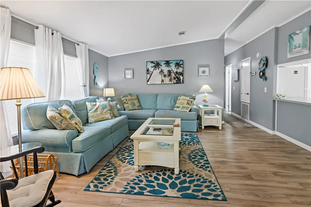 a living room with furniture and a rug