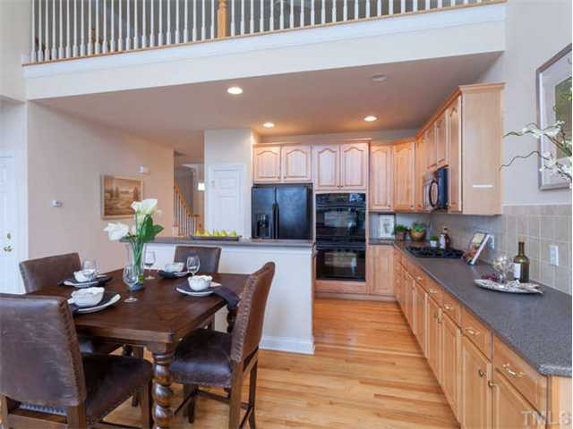 11545 Auldbury Way Raleigh, NC 27617 - Photo 8 of 25 The extended kitchen counter top provides the perfect spot for setting up a dinner buffet for your guests. Kitchen