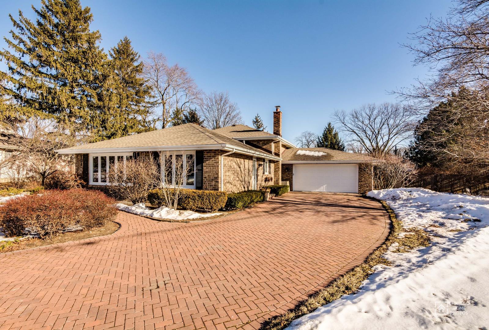 131 Chestnut Road Northbrook, IL 60062 - Photo 1 of 26 a front view of a house with yard and sitting area