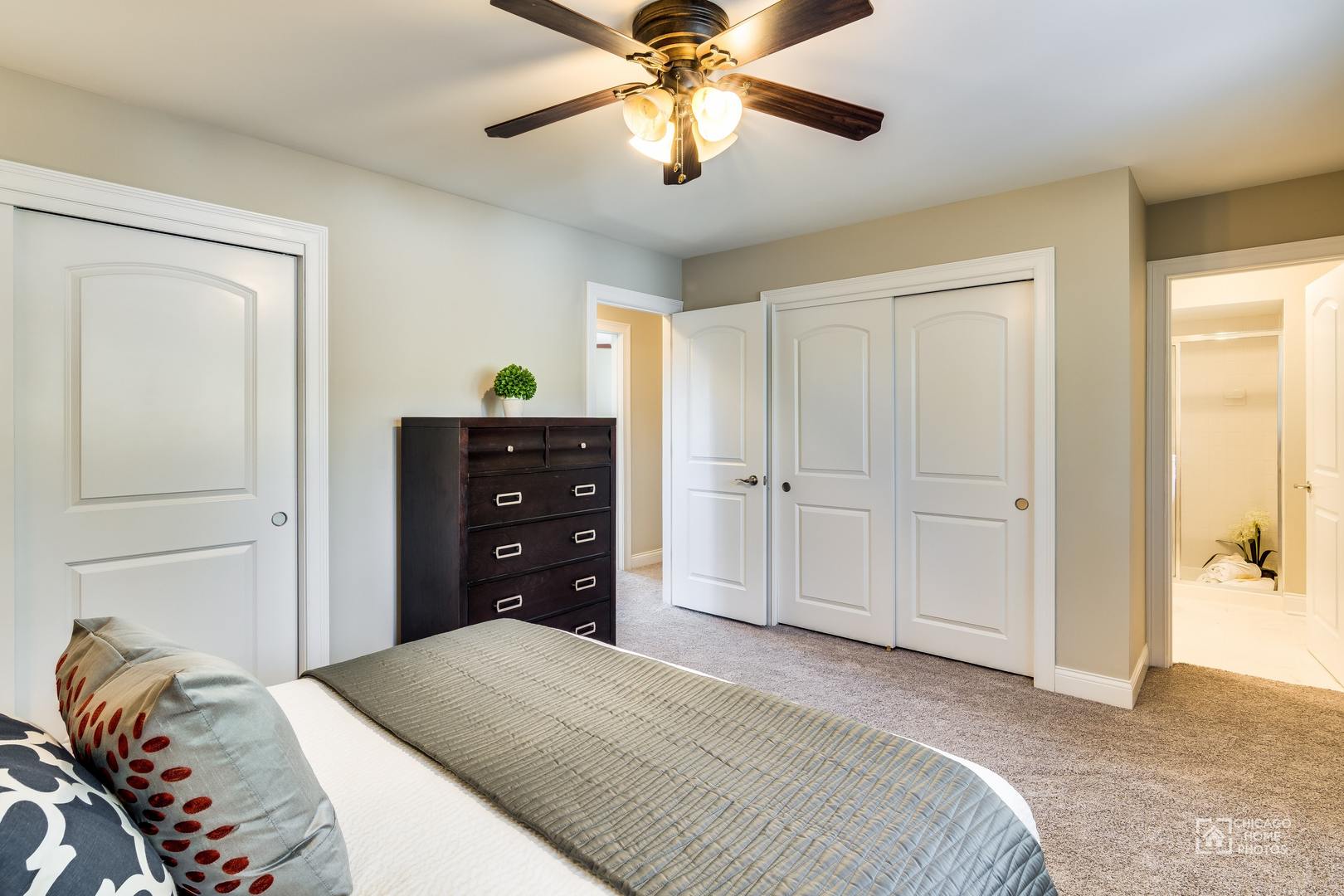 131 Chestnut Road Northbrook, IL 60062 - Photo 13 of 26 a bedroom with a bed and a chandelier