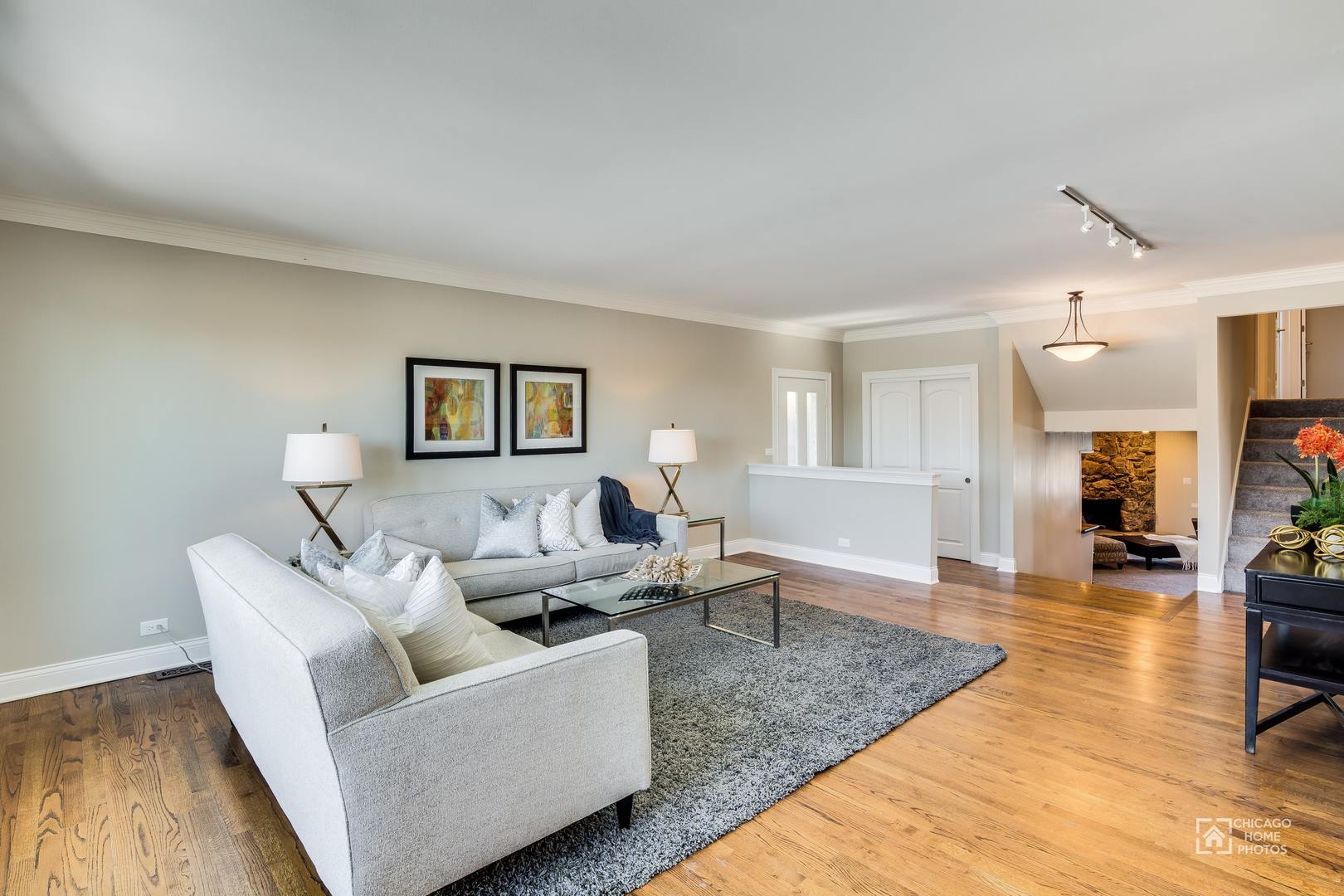 131 Chestnut Road Northbrook, IL 60062 - Photo 4 of 26 a living room with furniture and a wooden floor