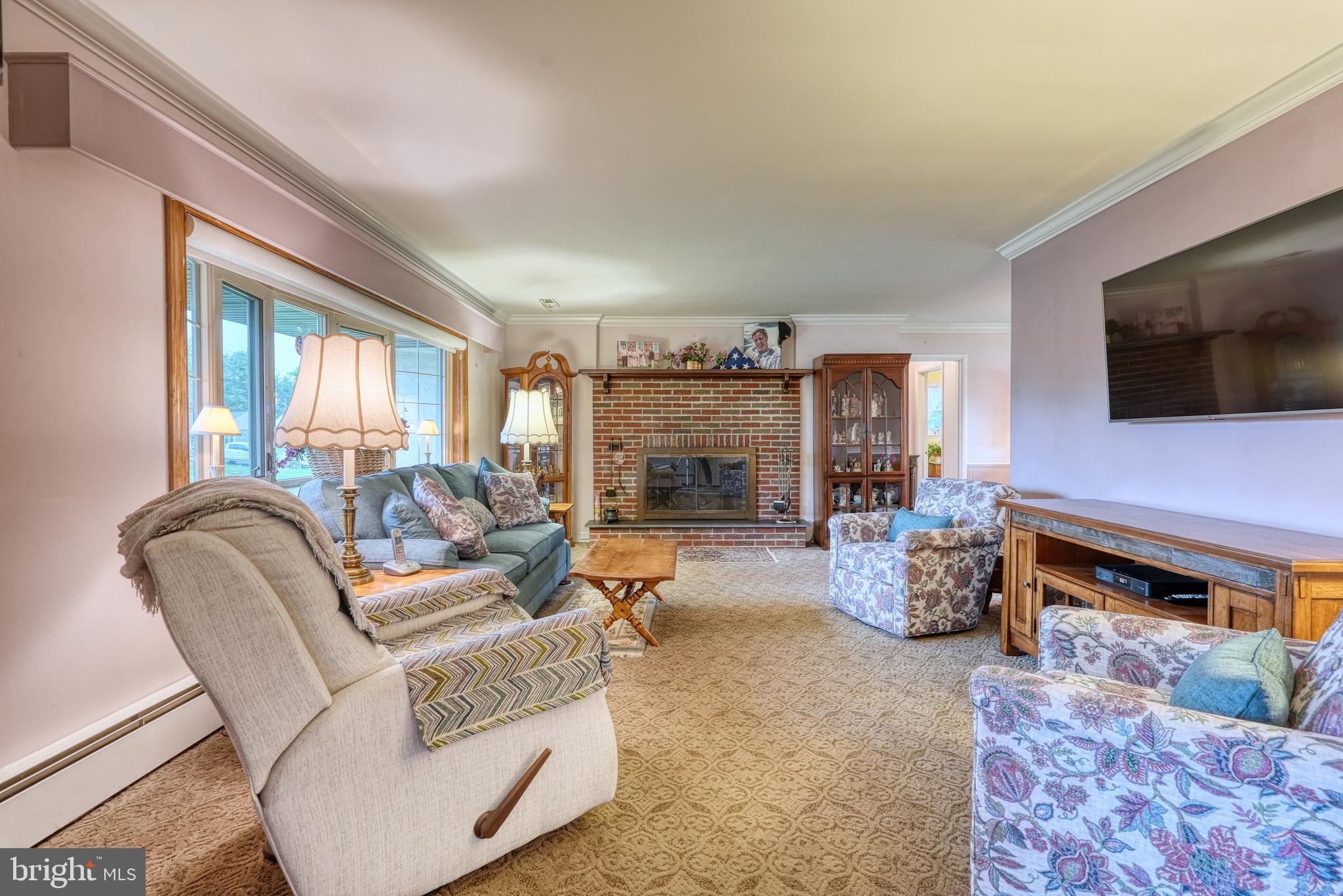 135 Holly Road Southampton, PA 18966 - Photo 11 of 52 a living room with furniture and a flat screen tv