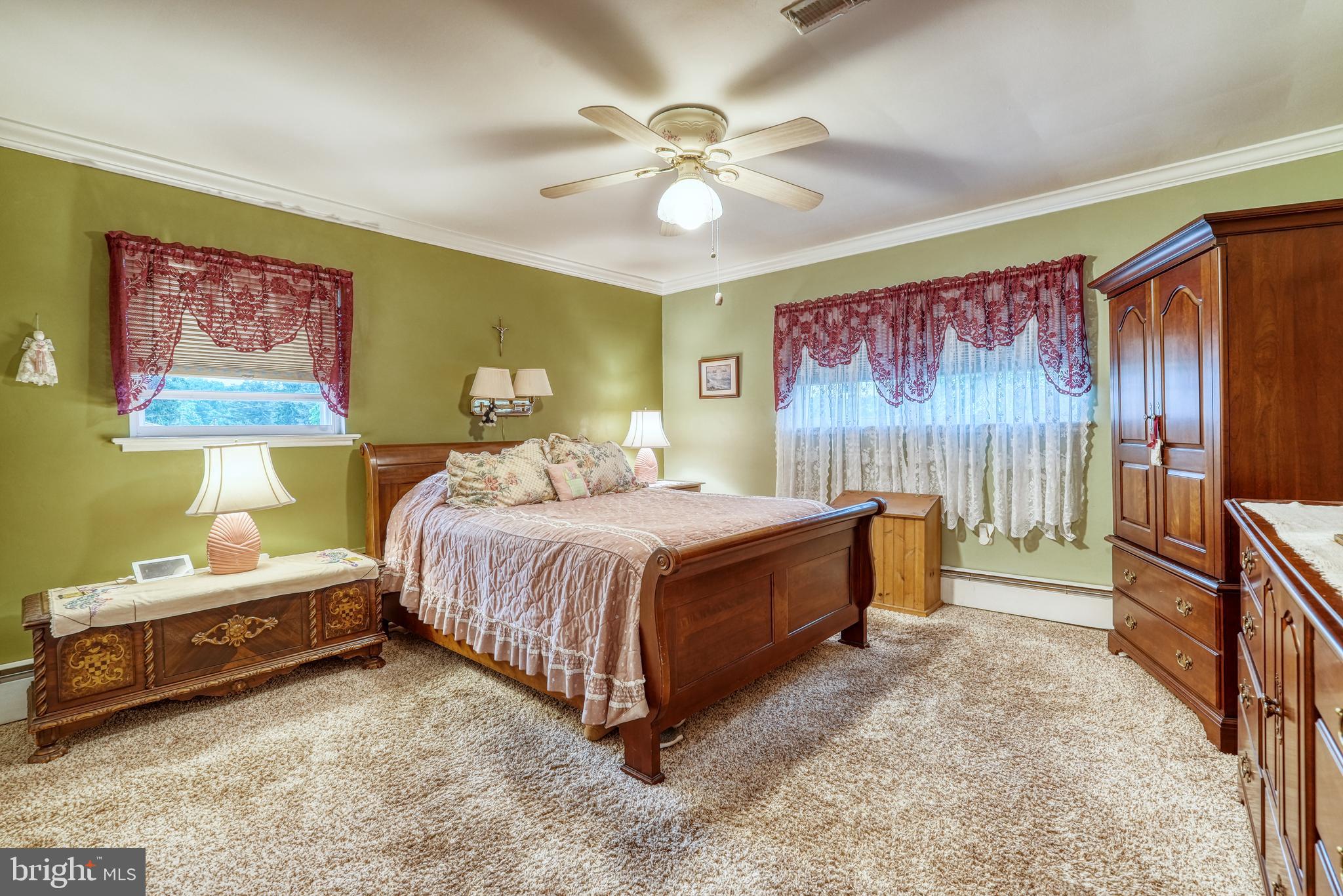 135 Holly Road Southampton, PA 18966 - Photo 23 of 52 a spacious bedroom with a bed and a chandelier