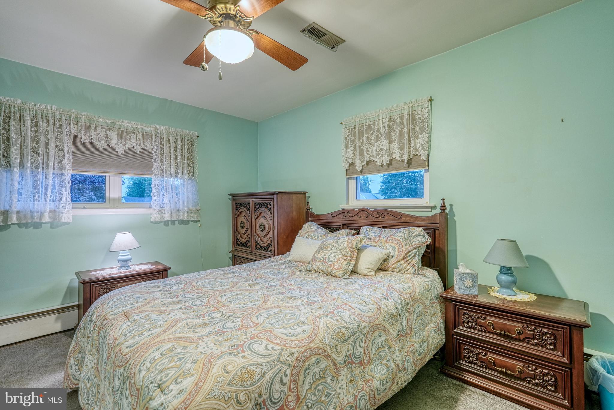135 Holly Road Southampton, PA 18966 - Photo 34 of 52 a bedroom with a bed and a chandelier