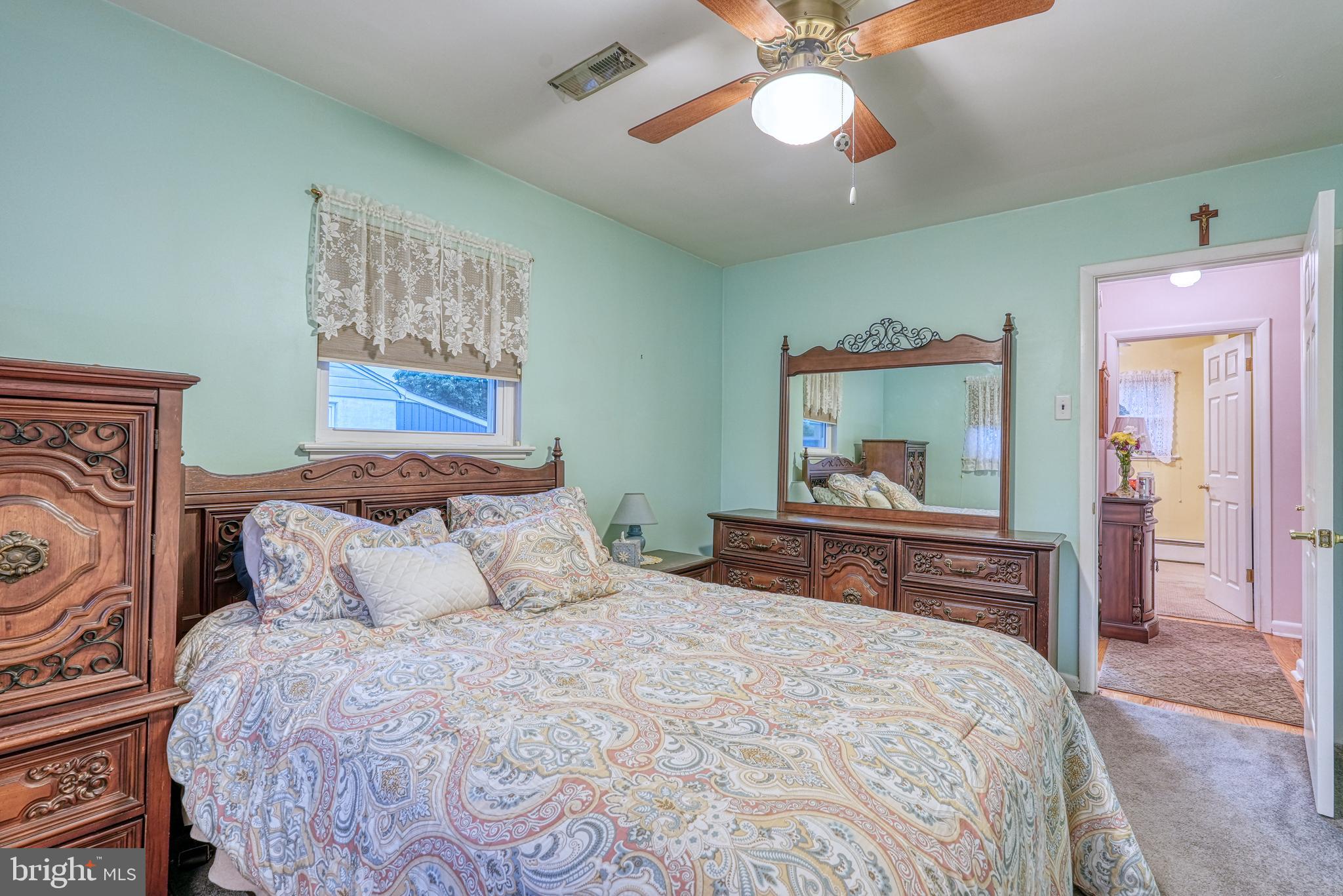135 Holly Road Southampton, PA 18966 - Photo 35 of 52 a bedroom with a bed and a chandelier