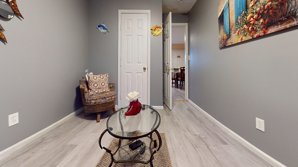 297 Main Street Springfield, MA 01151 - Photo 4 of 26 a room with furniture and wooden floor