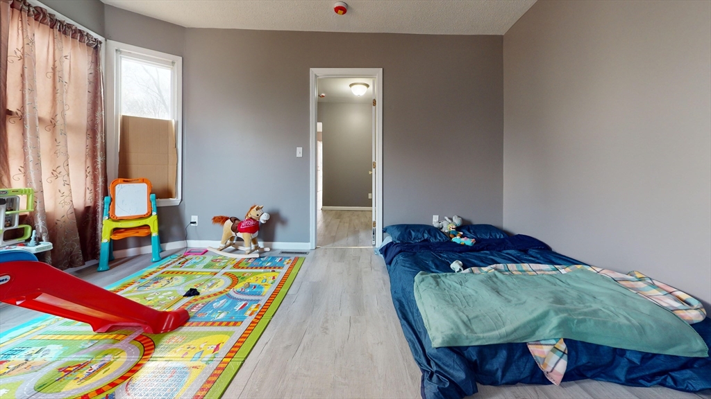 297 Main Street Springfield, MA 01151 - Photo 10 of 26 a living room filled with furniture and rug
