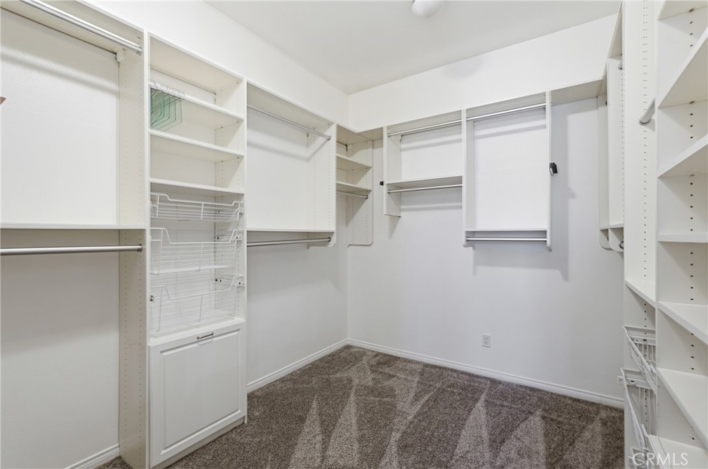 9 Orleans Road Rancho Mirage, CA 92270 - Photo 51 of 71 a view of walk in closet with empty racks