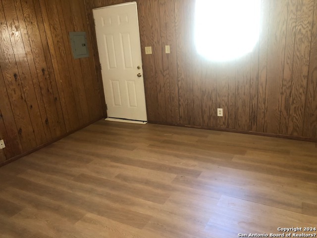 an empty room with wooden floor