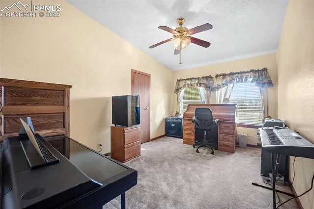 a view of a workspace with furniture and wooden floor