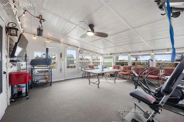 a kitchen that has a lot of cabinets and wooden floor