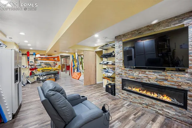 a kitchen view of microwave a stove and wooden floor