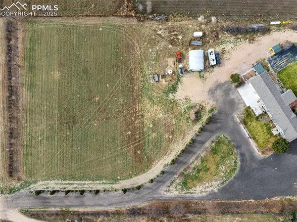 an aerial view of a house with a swimming pool