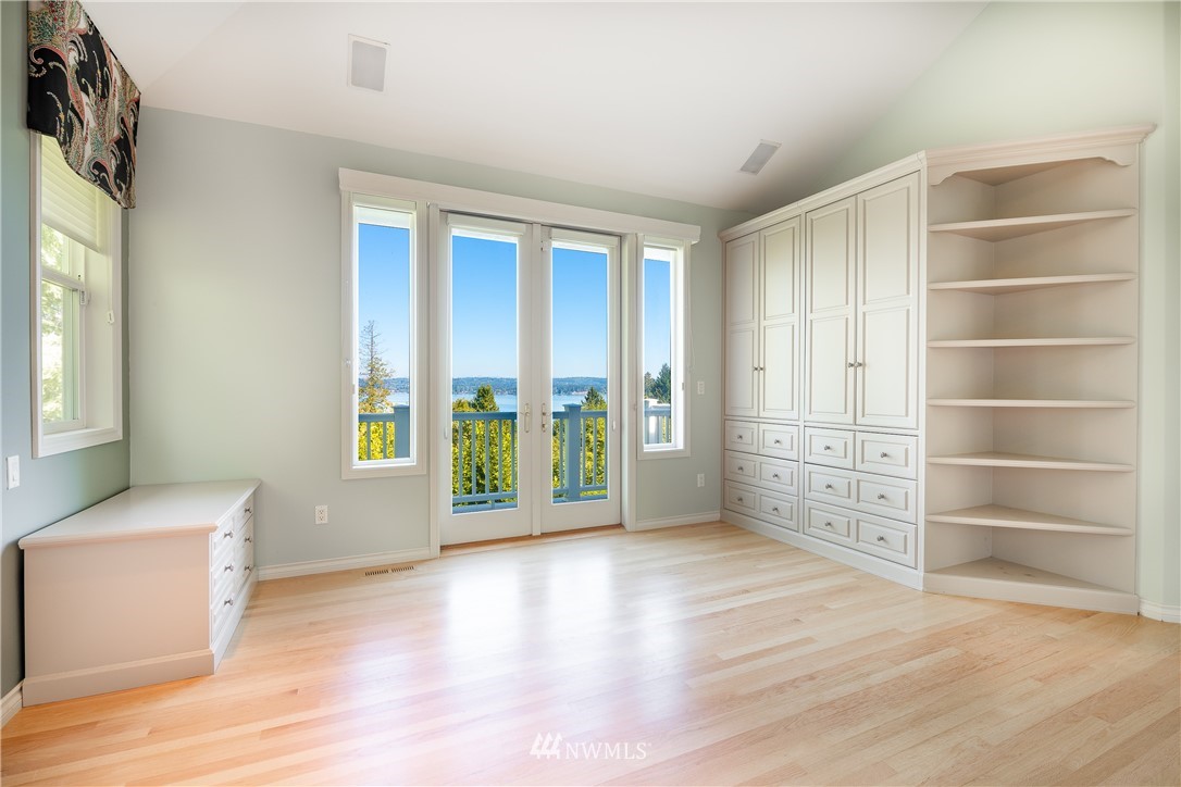5332 Canvasback Loop Blaine, WA 98230 - Photo 24 of 40 a view of an empty room with a window and wooden floor