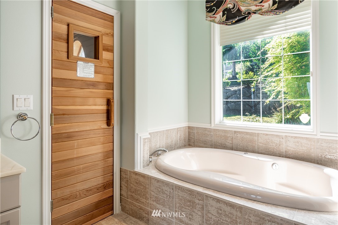 5332 Canvasback Loop Blaine, WA 98230 - Photo 27 of 40 a bathroom with a tub and a window